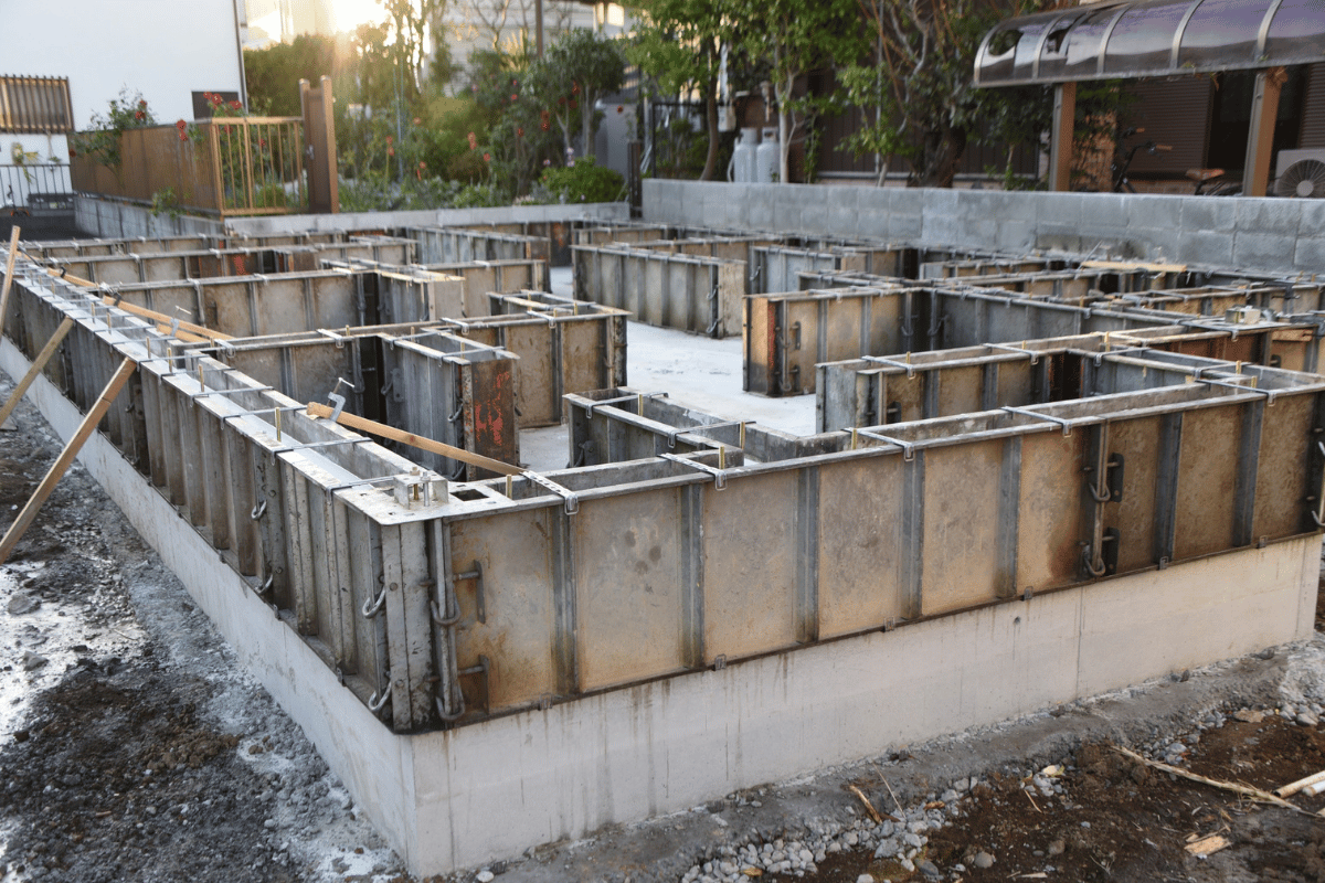 Construction crew working on concrete foundation